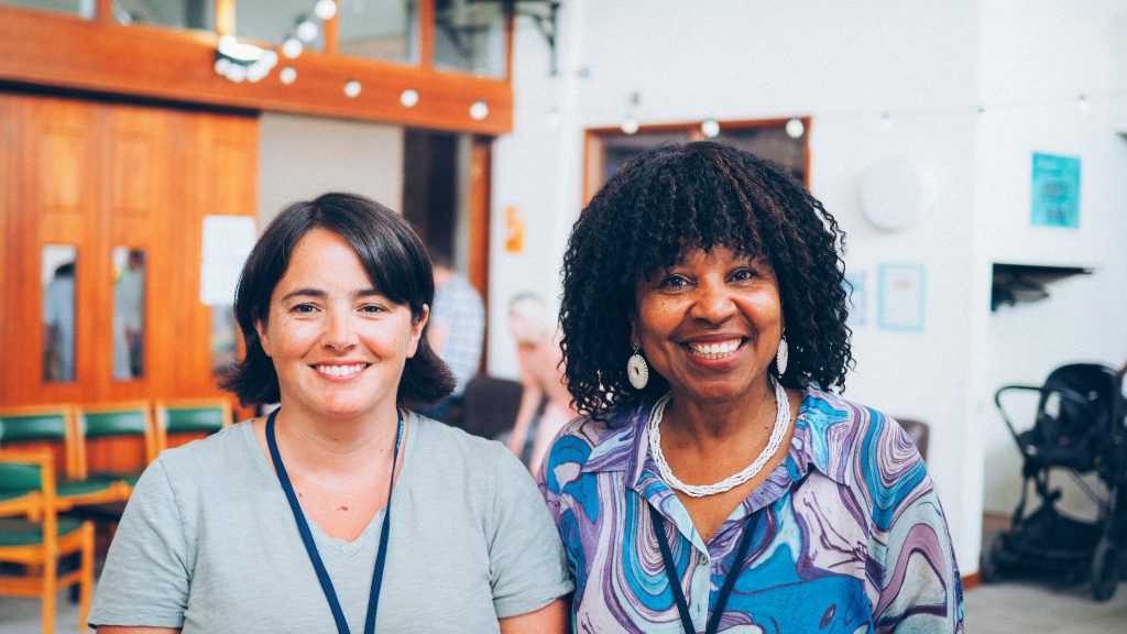 2 ladies smiling at the camera